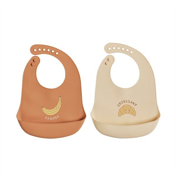 Set di bavaglini arancioni/color crema in silicone 2 pz Yummy – OYOY Mini
